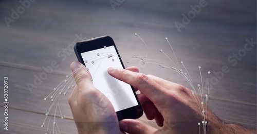 Composition of network of digital connections over person using smartphone with blank screen