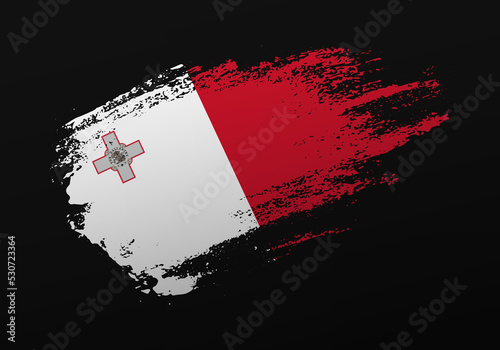 Abstract creative patriotic hand painted stain brush flag of Malta on black background
