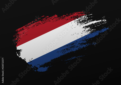 Abstract creative patriotic hand painted stain brush flag of Netherlands on black background