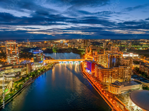 Yekaterinburg city and pond aerial panoramic view at summer or early autumn night. Night city in the early autumn or summer.