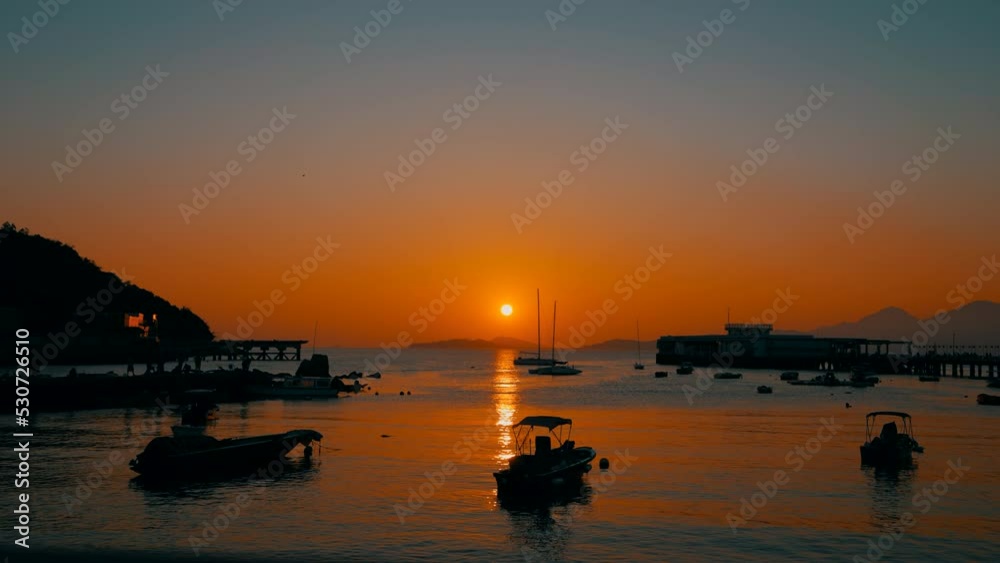 Time lapse of a little harbor of a little fisher village during a beautiful sunset. Few boats are going back to dock. Time lapse of a little harbor of a little fisher village during a beautiful sunset. Few boats are going back to dock.