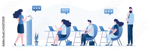 Female lecturer or speaker makes speech. Group of students listen to woman teacher. Lecture, business mentor speaks. People sit at workplaces. Business communication, presentation.