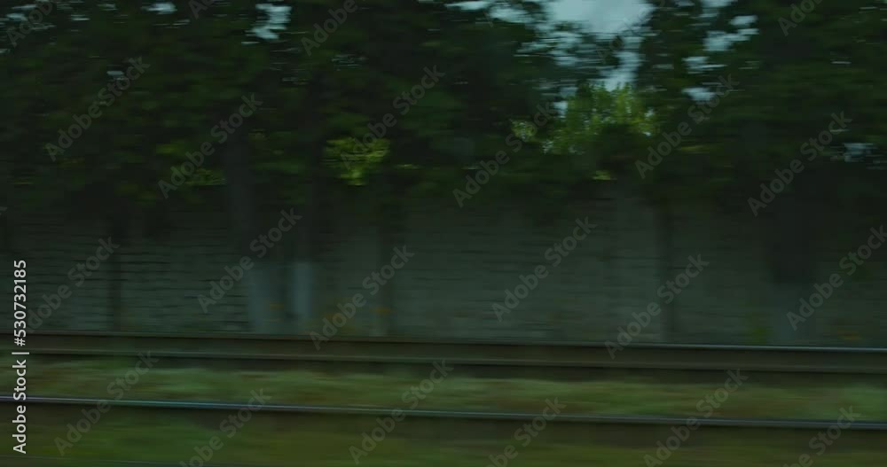 Window interior with city view on train, car, Russia. View from a window traveling through an urban suburban landscape. Window interior with city view on train, car, Russia. View from a window traveling through an urban suburban landscape.