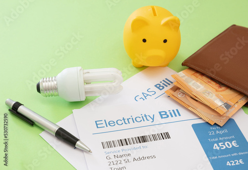 Fotografía Electricity bill, euro banknote, light bulb and piggy bank
