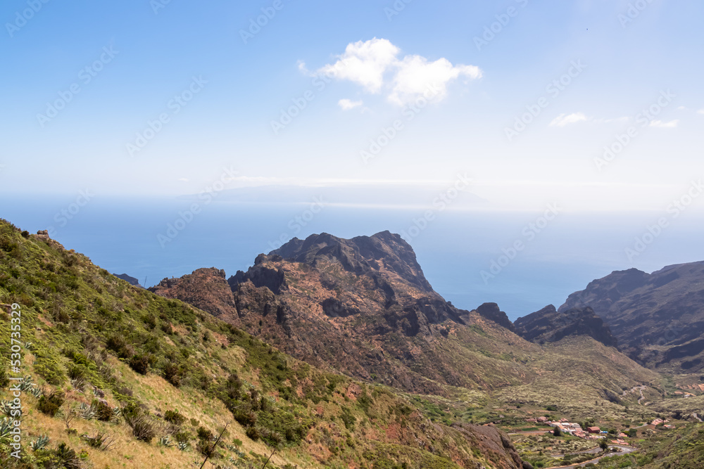 Panoramic view on rock formation Roque de la Fortaleza near remote village Masca in Teno mountain massif, Tenerife, Canary Islands, Spain, Europe. Coastal scenic hiking trail along the Atlantic Ocean