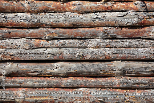 Wooden logs on the wall from the log house.