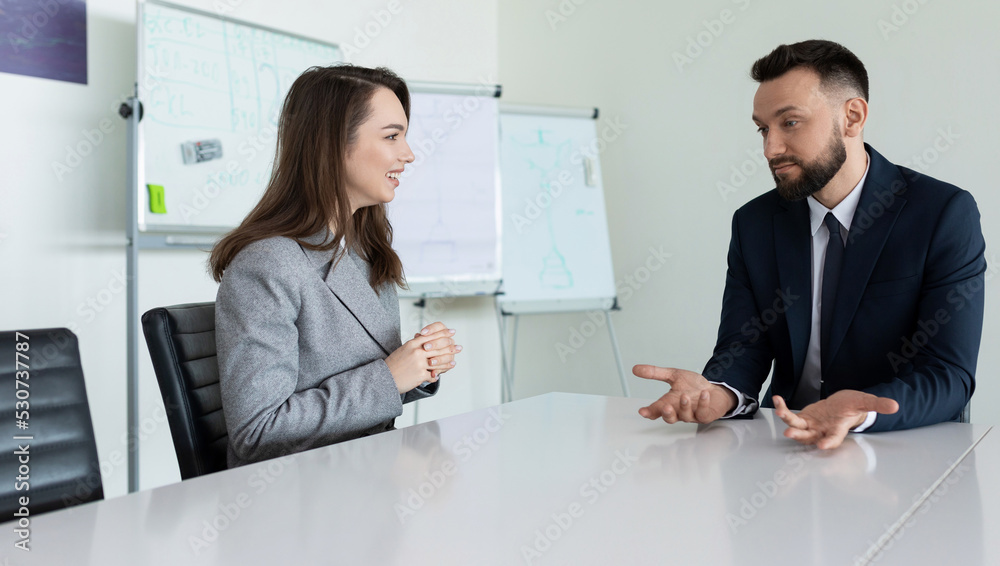 discussion of a new project in the office at the table in the meeting room discussion of a new project in the office at the table in the meeting room