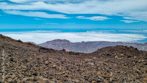 Hiking trail over volcanic desert terrain leading to summit of volcano Pico del Teide from Pico Viejo  Mount Teide National Park  Tenerife  Canary Islands  Spain  Europe. Solidified lava  ash  pumice