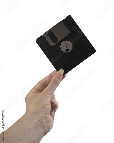 an old floppy disk in the female hand on a transparent background