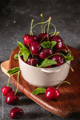 Fresh cherry in close up view on dark background photo