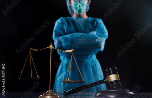 Obraz na płótnie Balance scale and justice mullet hammer is law protection medical doctor to diagnose exam patient and lead to death