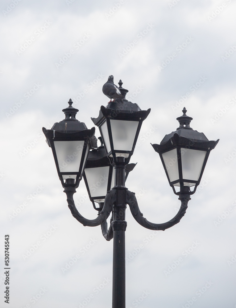 Street lamps against the sky. Energy crisis, save electricity.