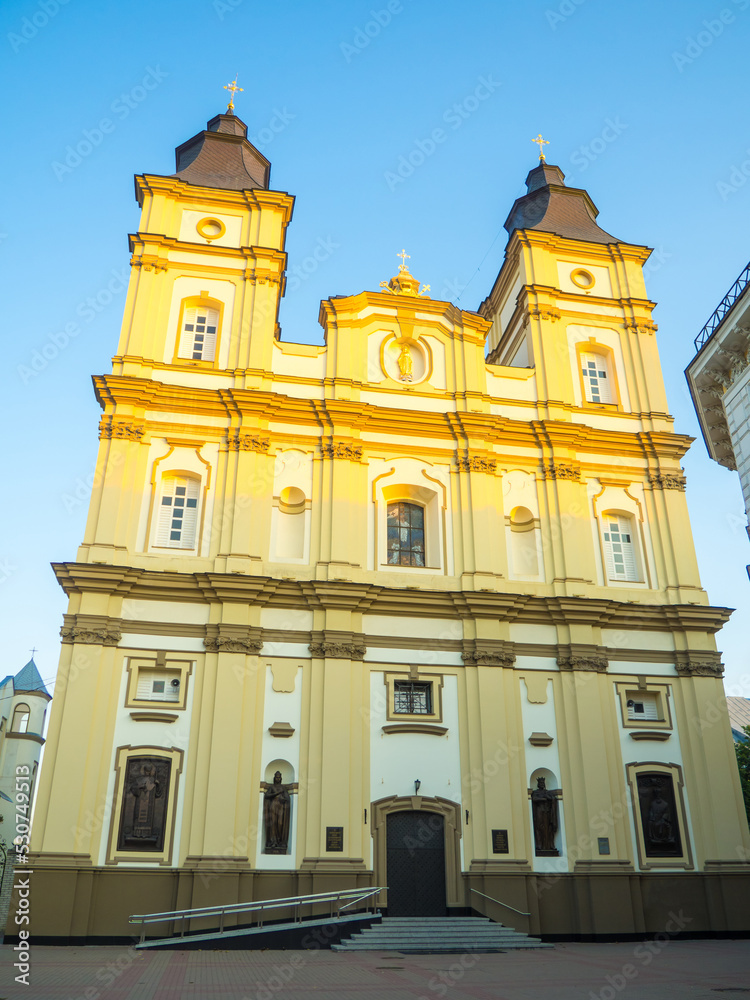 Fototapeta premium Ivano-Frankivsk, Cathedral of the Resurrection of Christ on summer morning. Sacral architecture of the church in the style of Austro-Bavarian baroque with elements of classicism against sky background