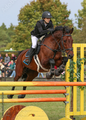 A girl and her horse in show jumping, Gotland Sweden.