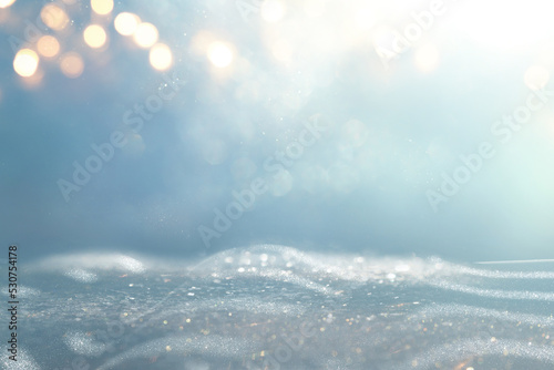 Photographie background of abstract gold, blue and silver glitter lights