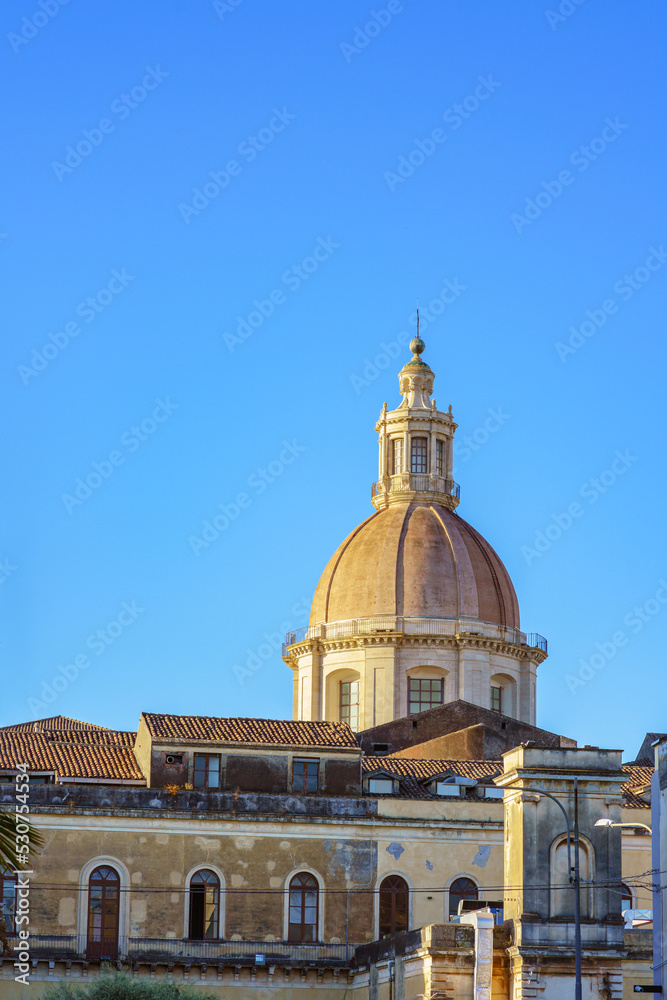View of the cupola of San Nicolò l'Arena in Catania, Sicily against blue sky