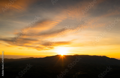 Aerial view Beautiful  panorama of morning scenery Golden light sunrise And the mist flows on high mountains forest. Pang Puai, Mae Moh, Lampang, Thailand. © 24Novembers