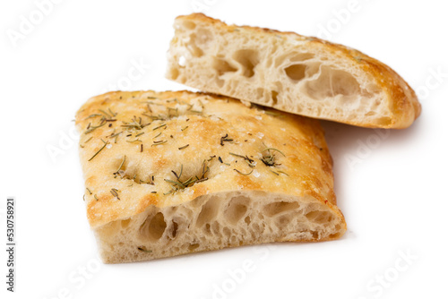 Fette di tipica focaccia romana condita con sale, rosmarino e olio di oliva, cibo italiano  photo