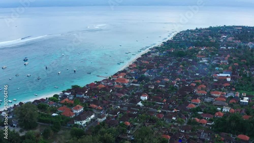 Top down aerial view of fishing harbour, fisherman village. Drone camera flying in the morning. Nusa lambogan, Indonesia photo