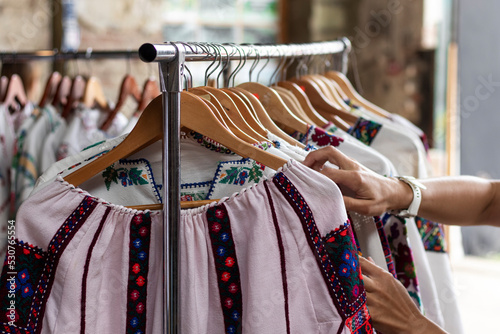 Embroidered shirts in traditional Ukrainian style at a vintage market.