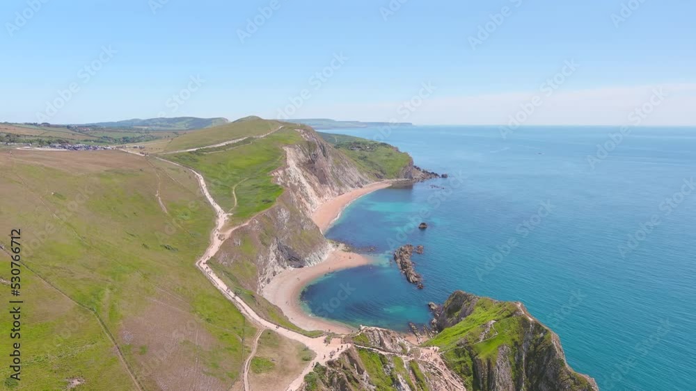 Aerial view of white limestone cliffs near Durdle Door on Jurassic Coast - landscape panorama of United Kingdom from above Aerial view of white limestone cliffs near Durdle Door on Jurassic Coast - landscape panorama of United Kingdom from above