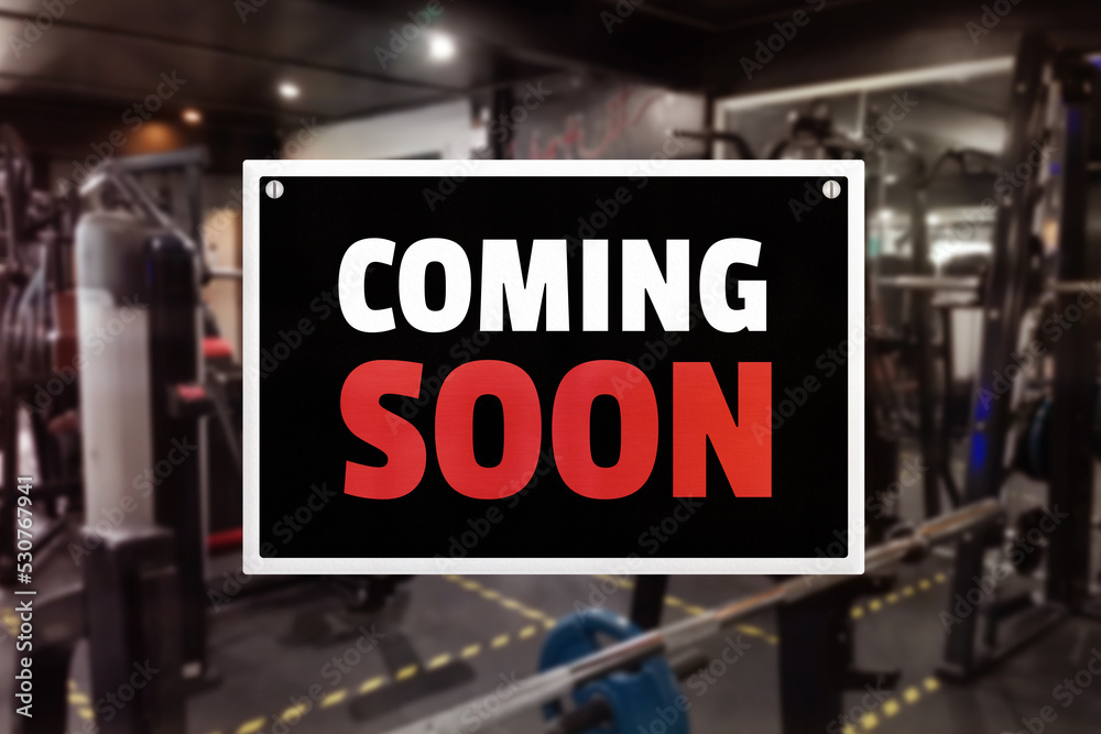 A coming soon sign at a gym. Promotion of upcoming fitness center. foto de  Stock | Adobe Stock