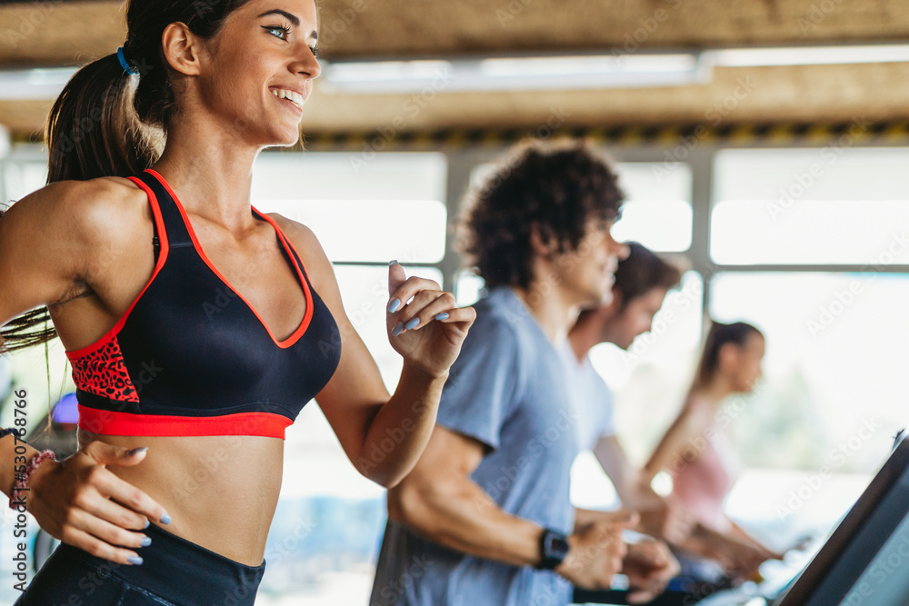 Group of happy fit people at the gym exercising, running. Stay healthy concept. Group of happy fit people at the gym exercising, running. Stay healthy concept.