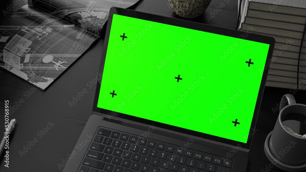 Laptop Mock-Up black color on work desk with notebook and cup coffee. Designed in dark tone. Can be used for background in education or business. Green screen and Animation, 3D Render.