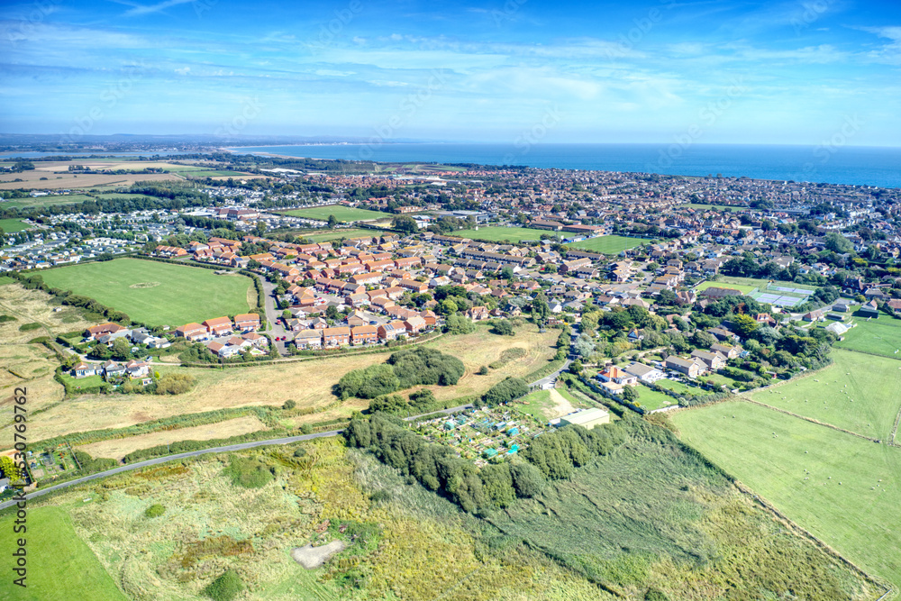 Aerial view towards the small town of Selsey in West Sussex Southern England which is surrounded by countryside and fields. Aerial view towards the small town of Selsey in West Sussex Southern England which is surrounded by countryside and fields.