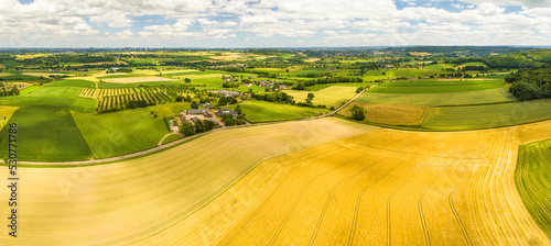 Aerial panorama of hilly countryside with cropland, meadows and fruit orchards, Zuid Limburg, Netherlands.