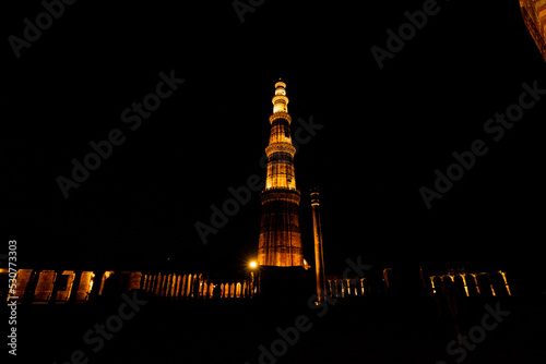 Qutub minar at night with lights photo