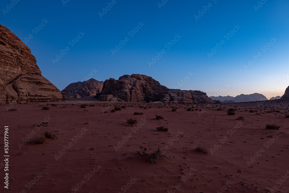 Desert landscape at golden hour at sunset in the Wadi Rum desert, Jordan Desert landscape at golden hour at sunset in the Wadi Rum desert, Jordan