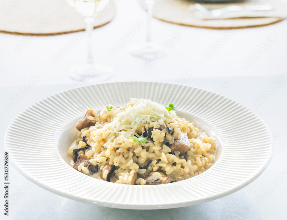 Dish of delicious Italian Mushroom risotto (boletus edulis) with parmesan cheese