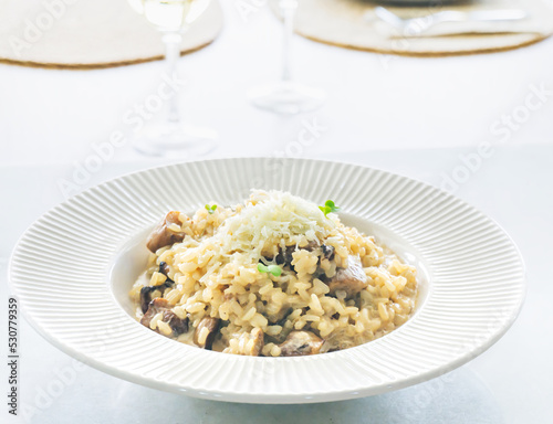 Dish of delicious Italian Mushroom risotto (boletus edulis) with parmesan cheese