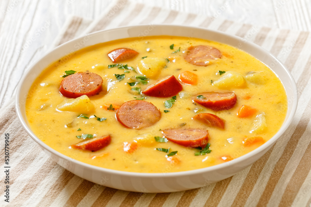 German potato soup with sausages in bowl German potato soup with sausages in bowl