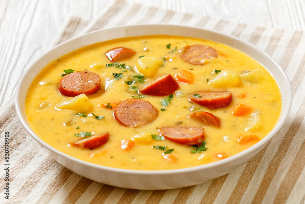 German potato soup with sausages in bowl