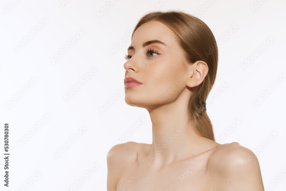 Closeup portrait of beautiful young girl with clean well-kept skin isolated over white background. Skin care. Facial treatment. Cosmetology, beauty and spa. Closeup portrait of beautiful young girl with clean well-kept skin isolated over white background. Skin care. Facial treatment. Cosmetology, beauty and spa.