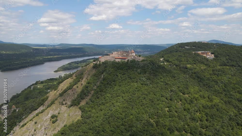 Ultra wide aerial shot of Visegrad castle on mountain peak in Hungary Europe Ultra wide aerial shot of Visegrad castle on mountain peak in Hungary Europe