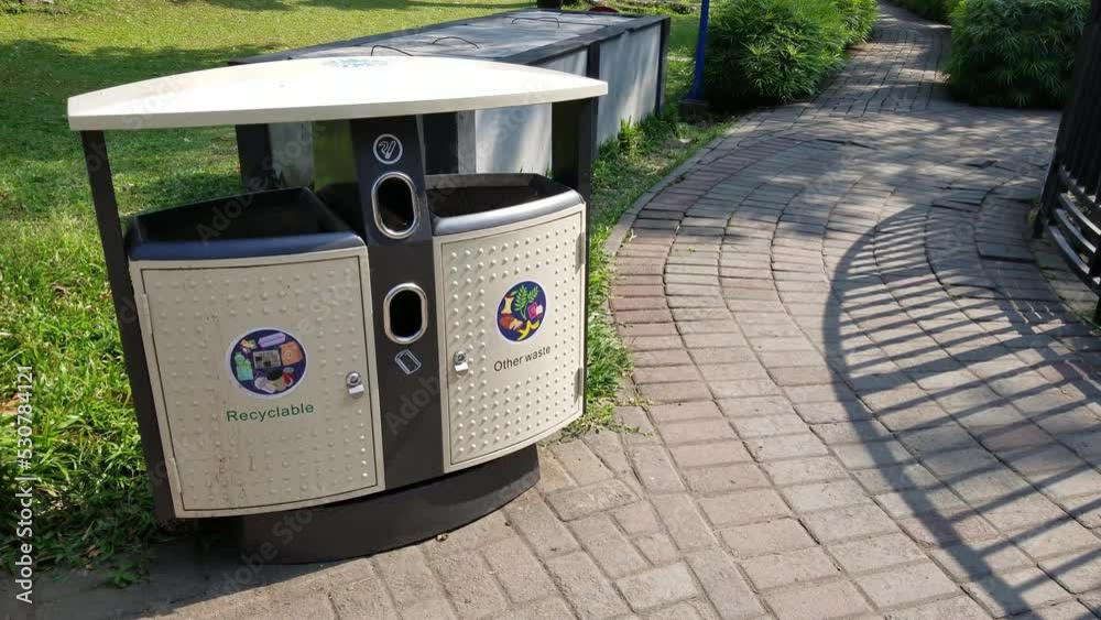 2 types of recyclable trash containers and more around the park. 2