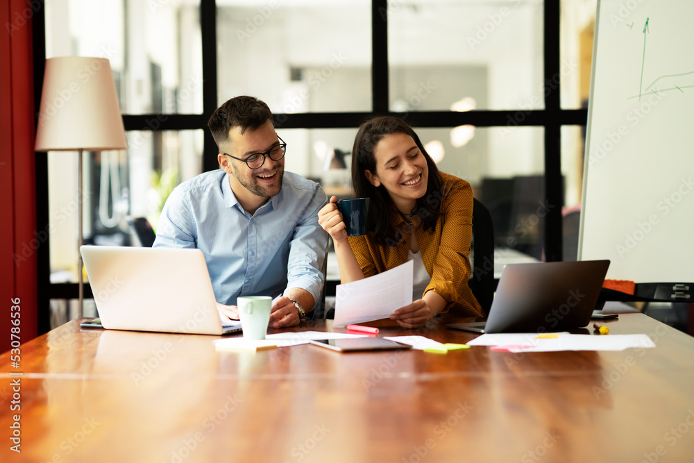 Colleagues in office. Businesswoman and businessman working on the project. Colleagues in office. Businesswoman and businessman working on the project.