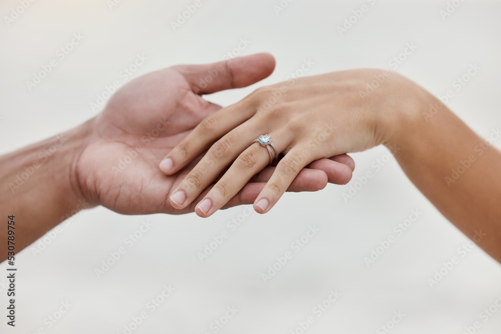 Engagement ring, hands and proposal of engaged couple romantic marriage celebration. Zoom on diamond jewelry finger for love, save the date and announcement of special occasion in commitment together Engagement ring, hands and proposal of engaged couple romantic marriage celebration. Zoom on diamond jewelry finger for love, save the date and announcement of special occasion in commitment together