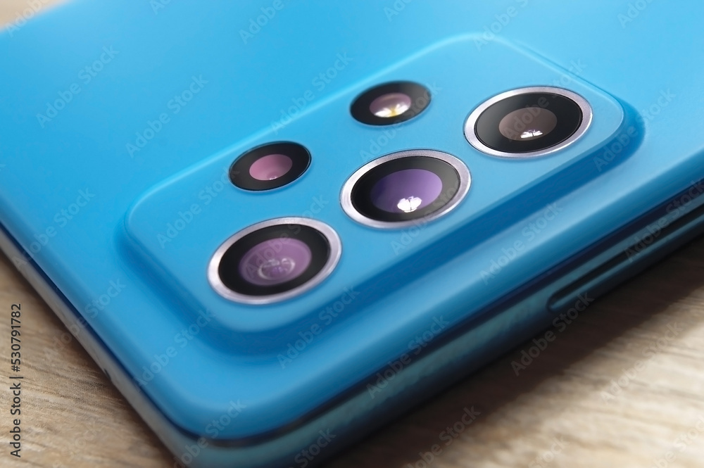 Fototapeta premium camera lenses on the back cover of the smartphone. close-up