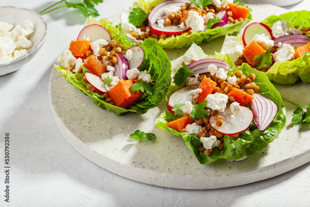 healthy sweet potato lettuce boats with radish, feta cheese, lentils