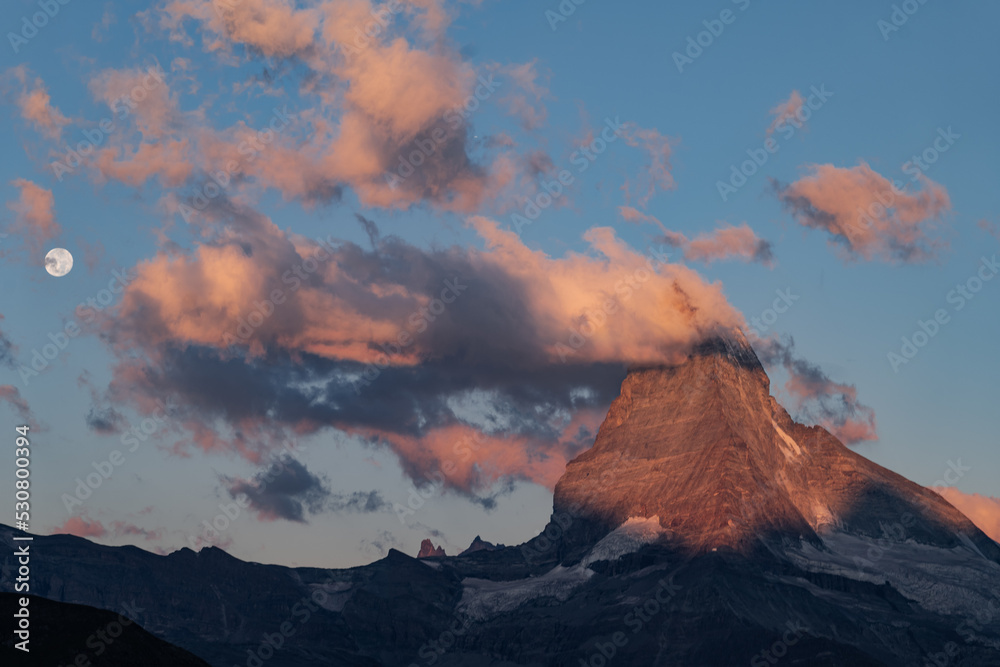 Sunrise with a view of the Materrhorn peak on Lake Stellisee, golden hour, Zermatt, Switzerland