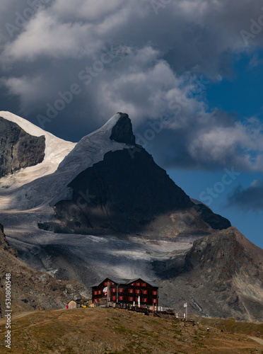 Fluhalp mountain hut in the Swiss Alps at sunset photo