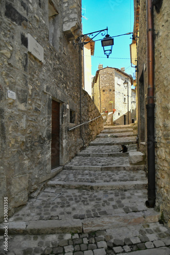 A narrow street between the old stone houses of Barrea  a medieval village in the Abruzzo region of Italy.