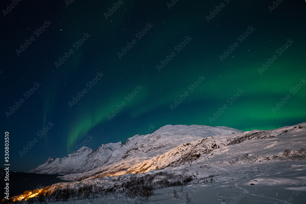 snowy mountain landscape and aurora borealis
Tromso Norway