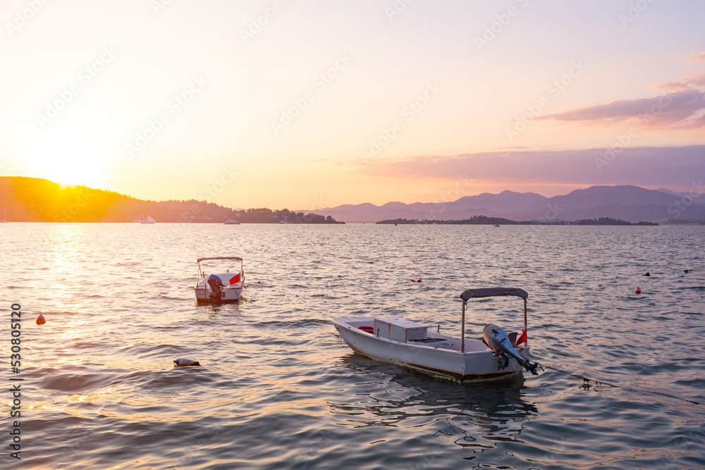 Boat in sunset floating on the sea in Turkey