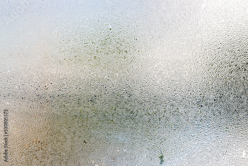 Fotobehang Misted glass, silver rain drops dew drops on transparent glass window
