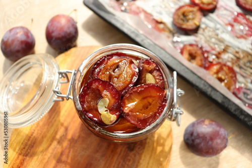 plum dried in the oven with spices and garlic for harvesting for the winter in jars delicacy